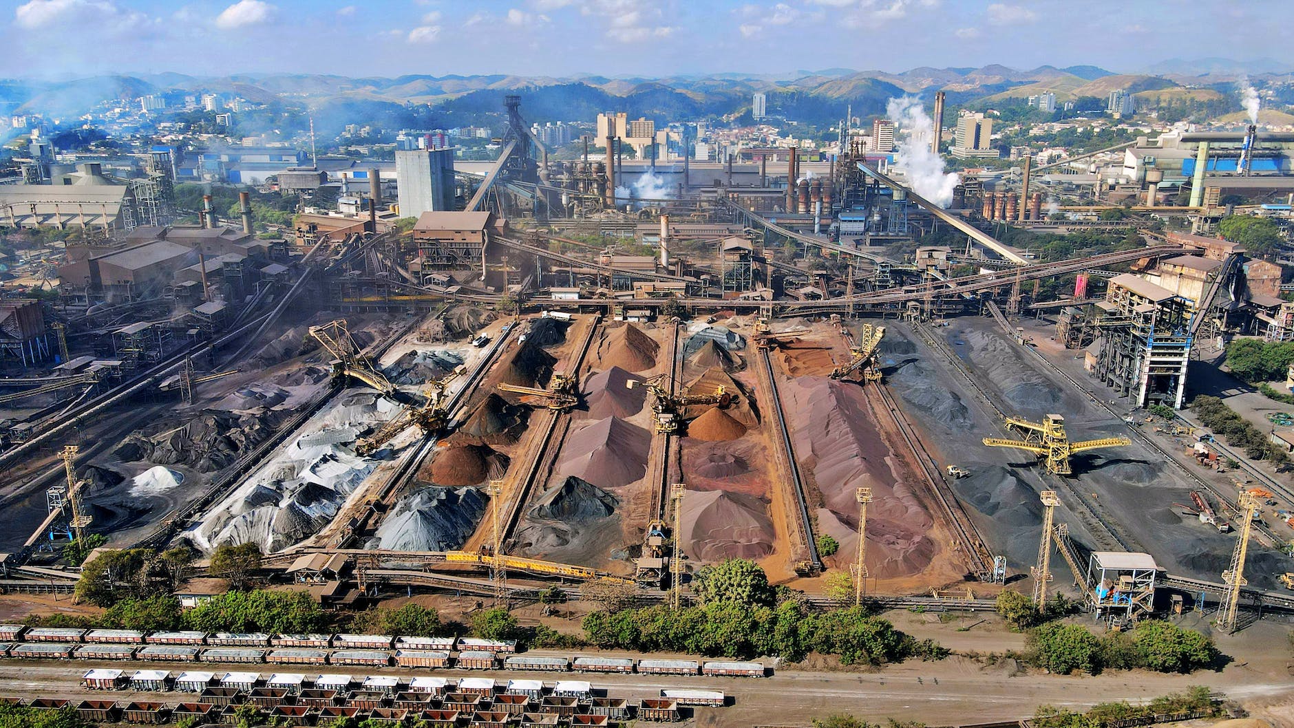 high angle view of an industrial landscape with slag heaps and cranes